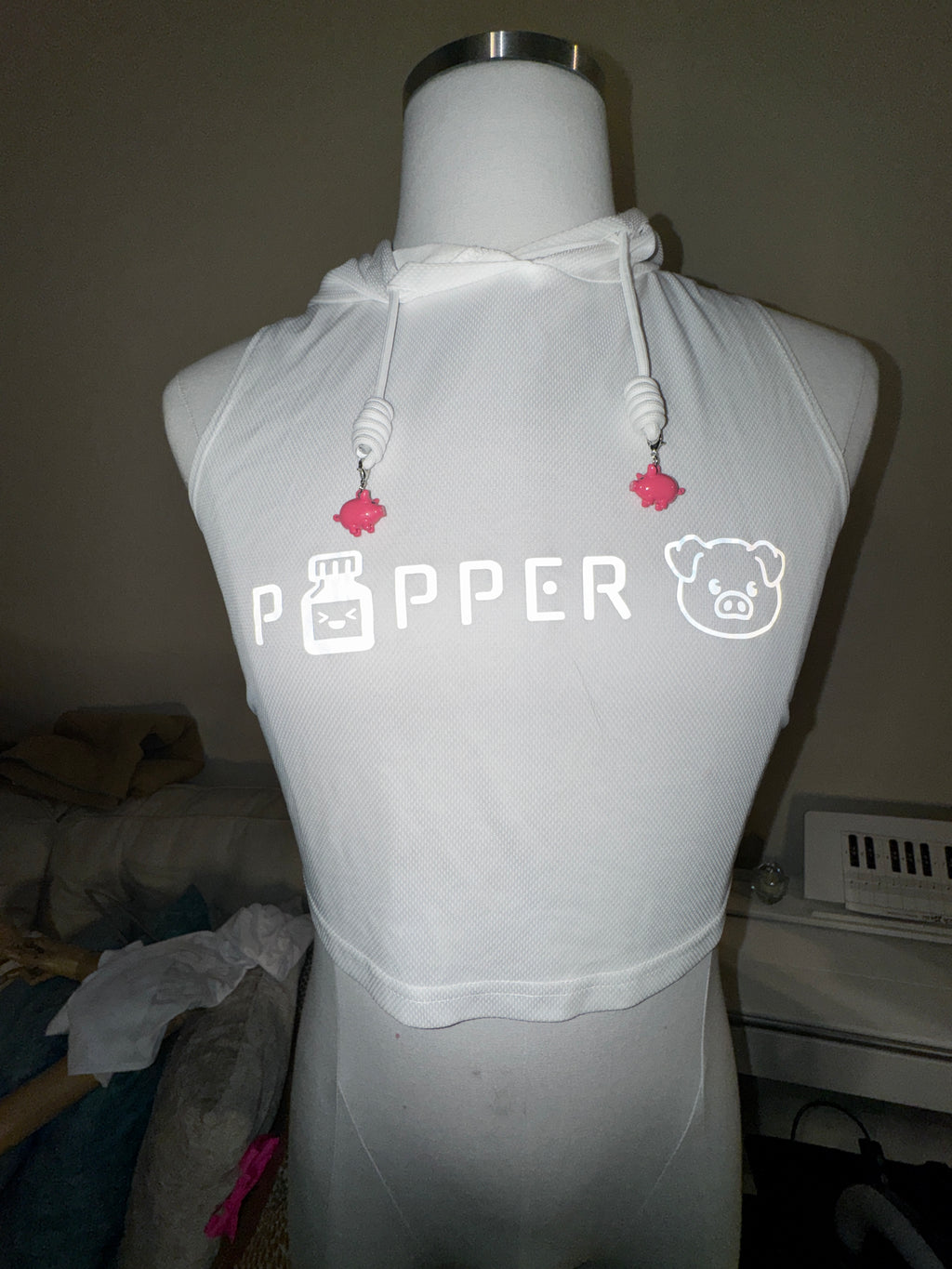 ‘popper pig’ reflective hooded tank with mini pig charms